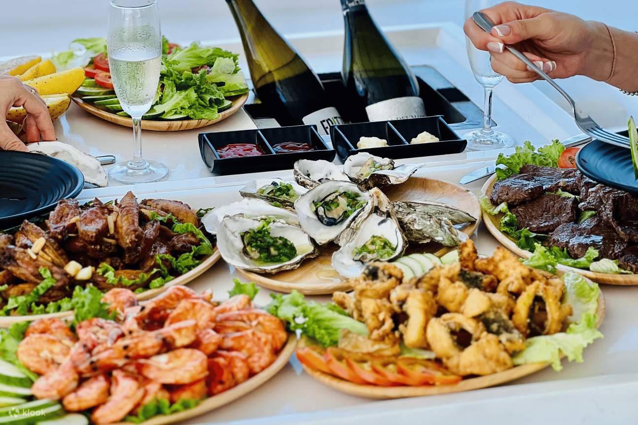 Guests enjoying BBQ dinner on Phu Quoc sunset cruise